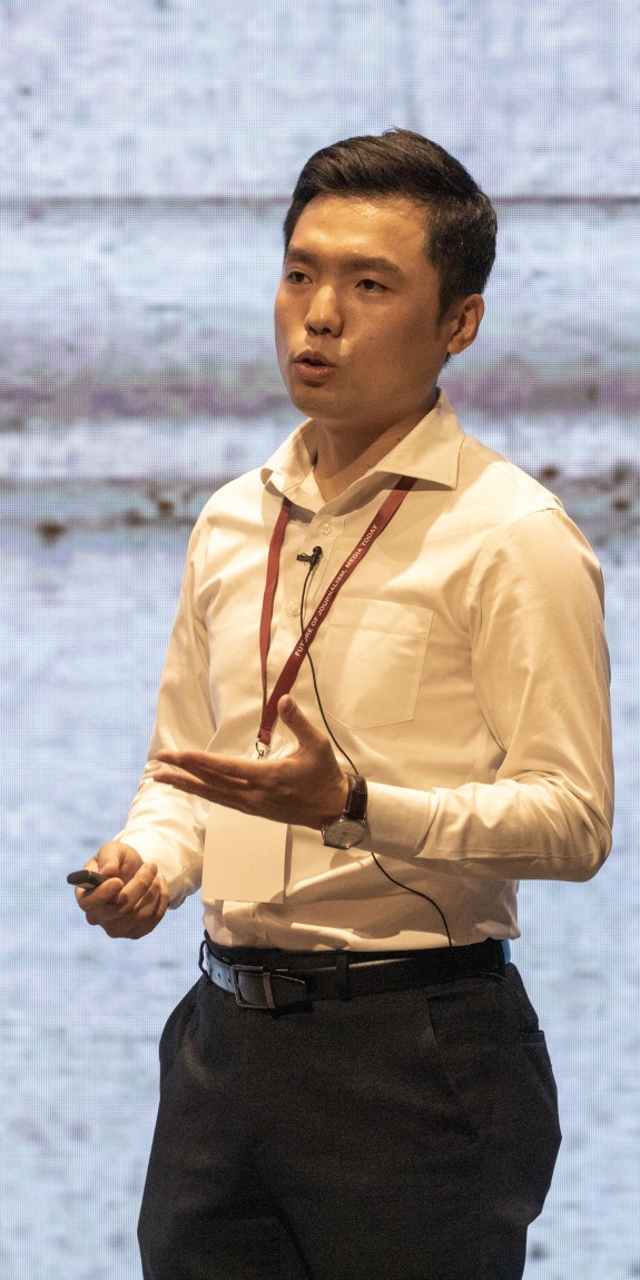 A man speaks at a conference